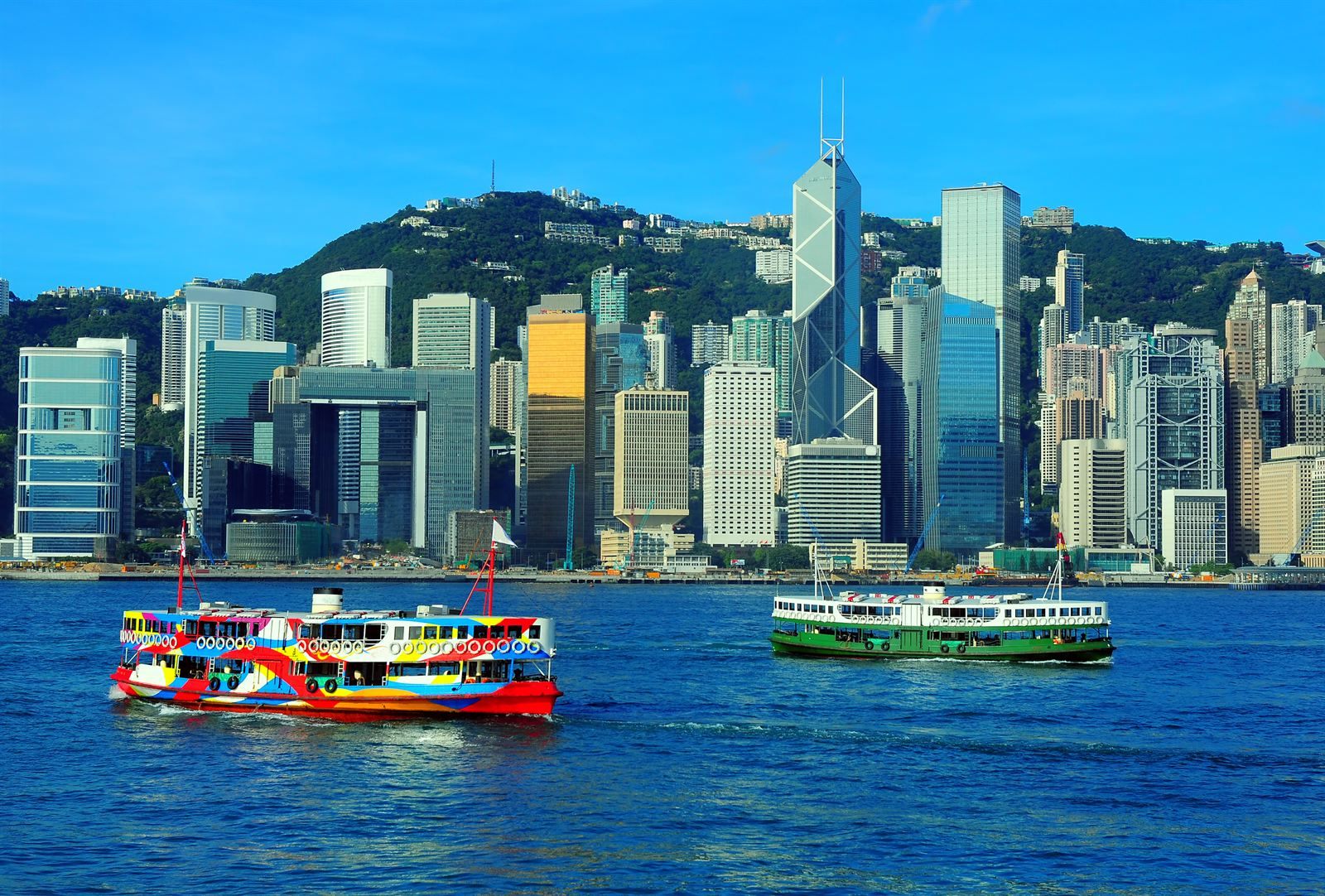 Star Ferry crossing Victoria Harbour in front of the Hong Kong Island skyline