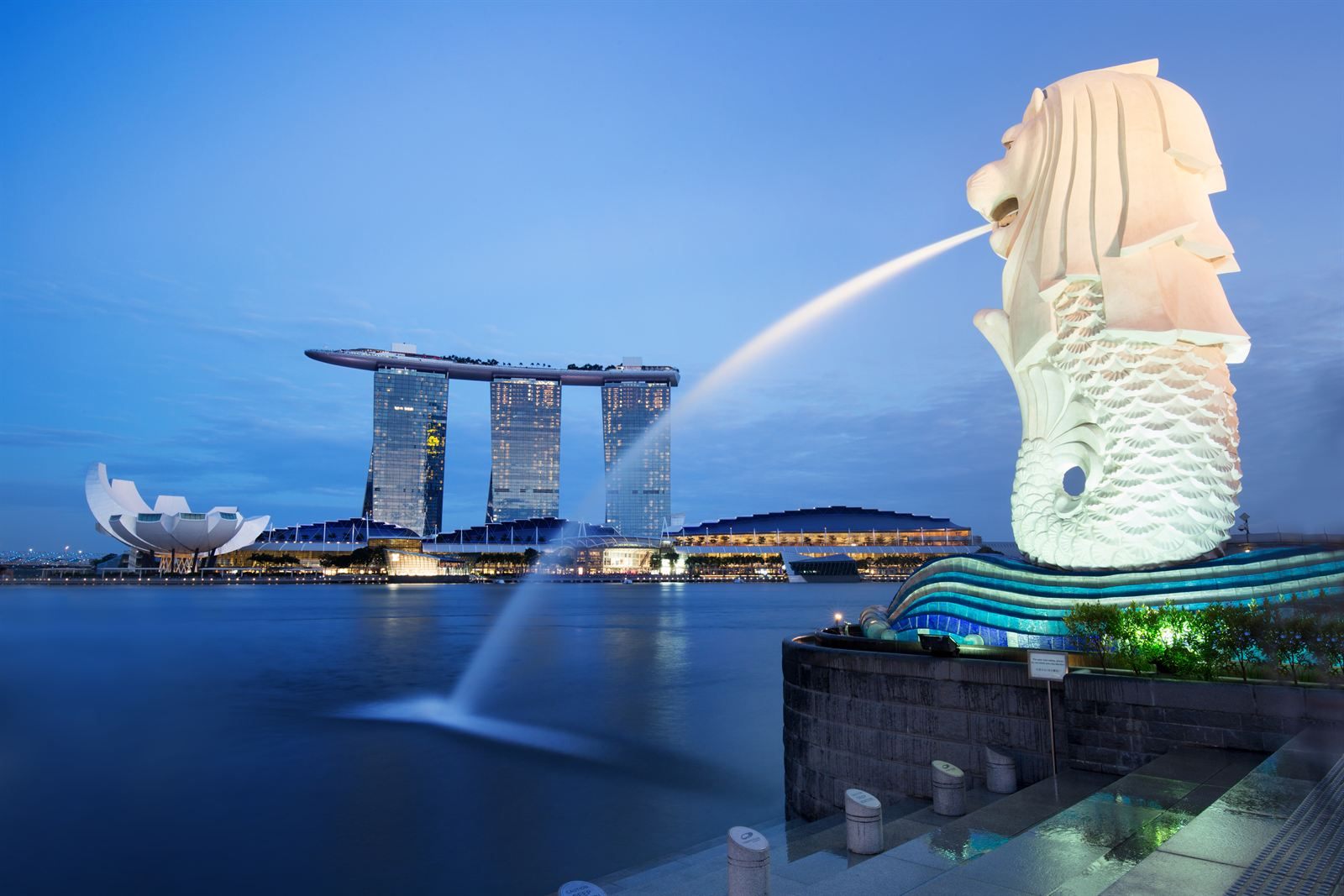 Merlion fountain spouting into Marina Bay with Marina Bay Sands behind, Singapore
