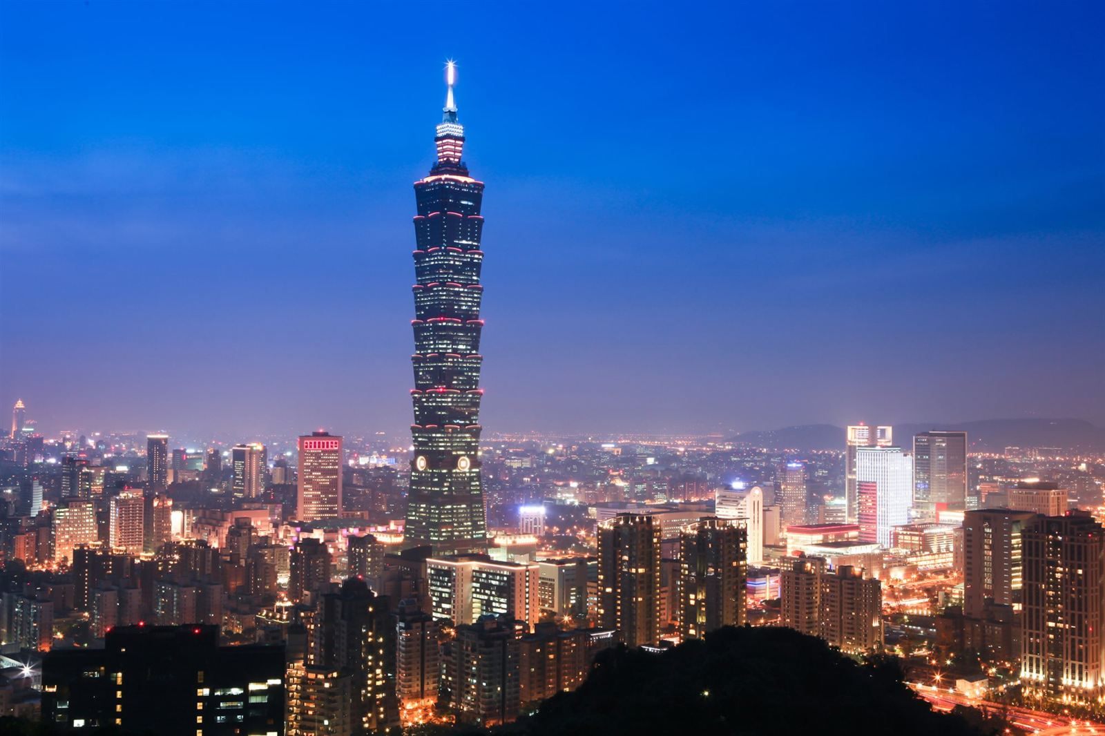Taipei 101 tower above the Taipei city skyline at dusk